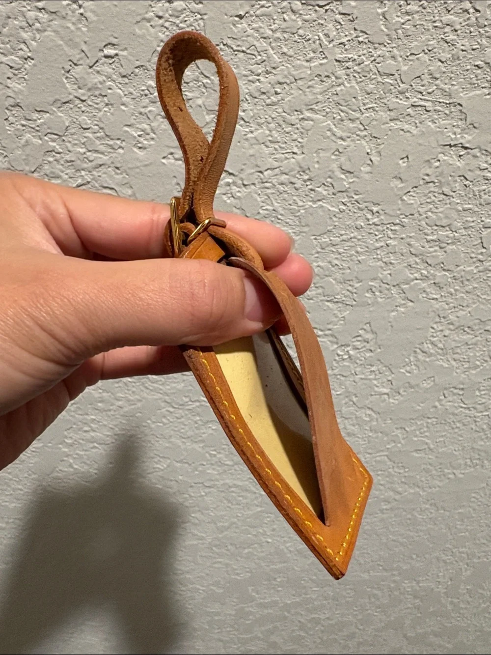 Louis Vuitton leather luggage tag.